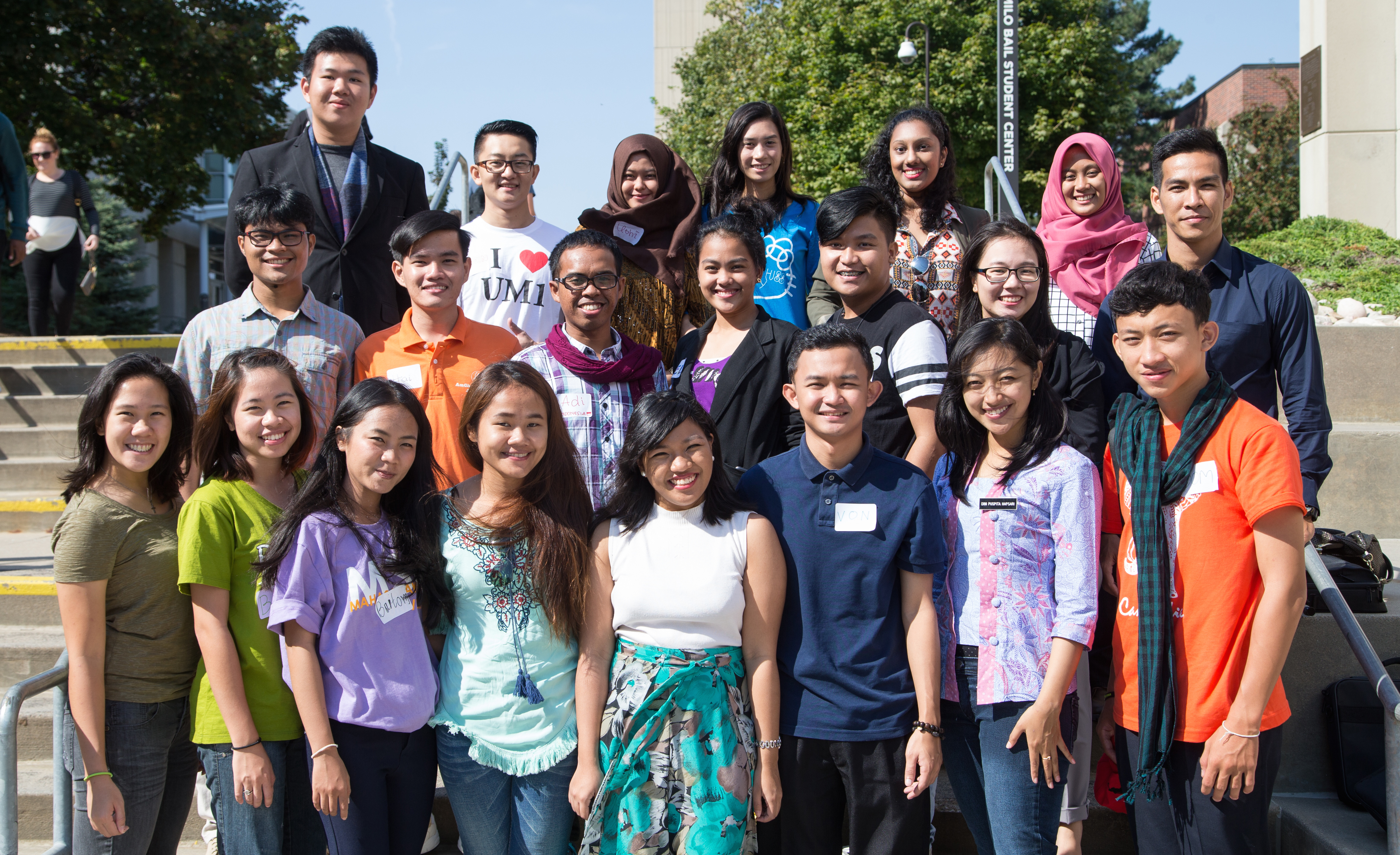 All 21 students pose for a photograph outside UNO's Milo Bail Student Center